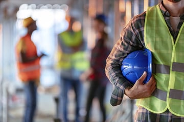 Builders working in construction site.