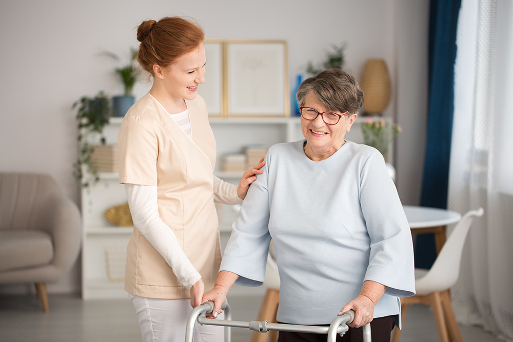 Elderly woman in rehabilitation with a nurse.