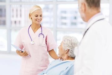 Elderly woman together with a nurse and a doctor.