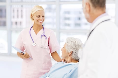 Elderly woman together with a nurse and a doctor.