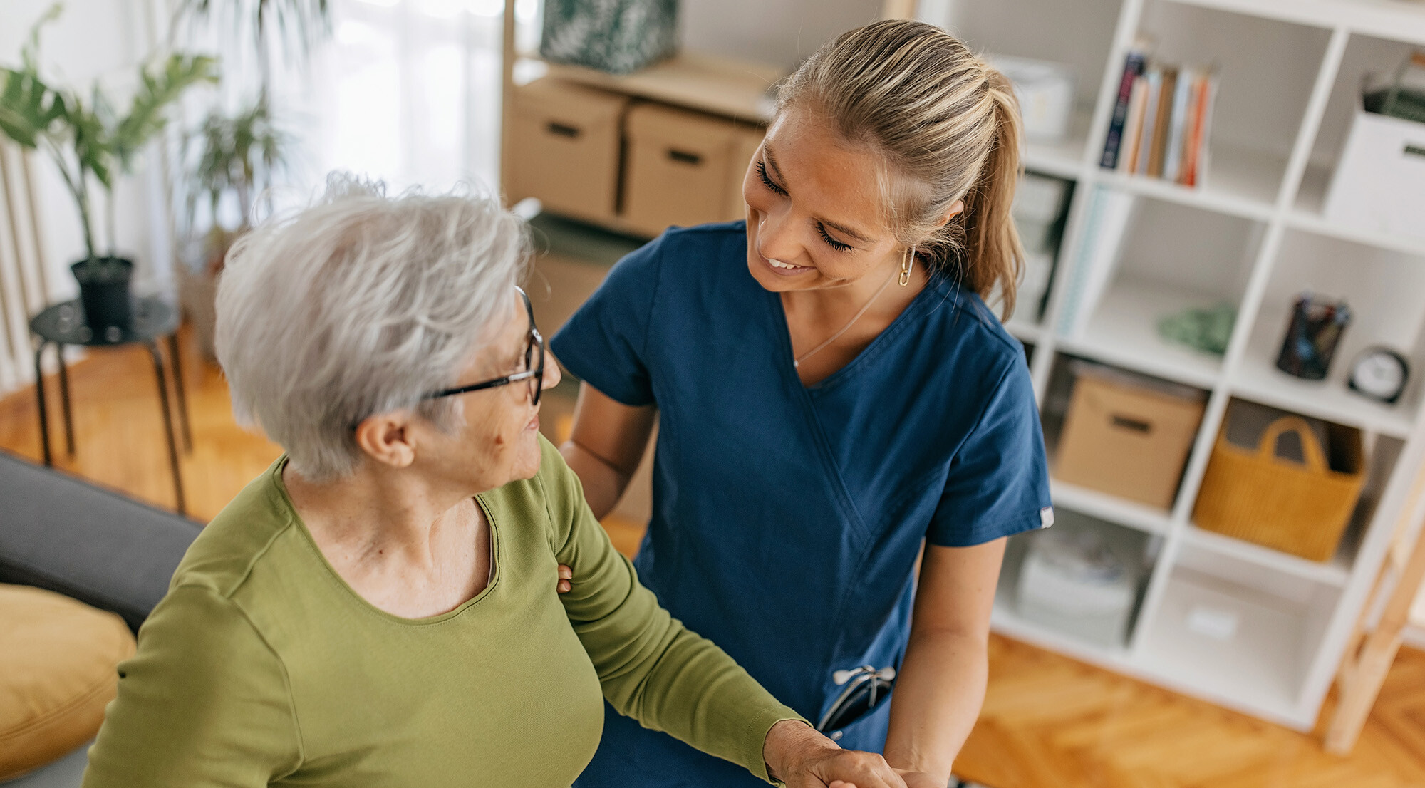 Elderly woman in rehabilitation with a nurse